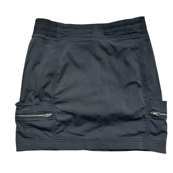 Athleta Dresses & Skirts - Athleta nylon shell black skort with zippered side pockets size 4/fits 2